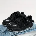 Black chunky platform sneakers.