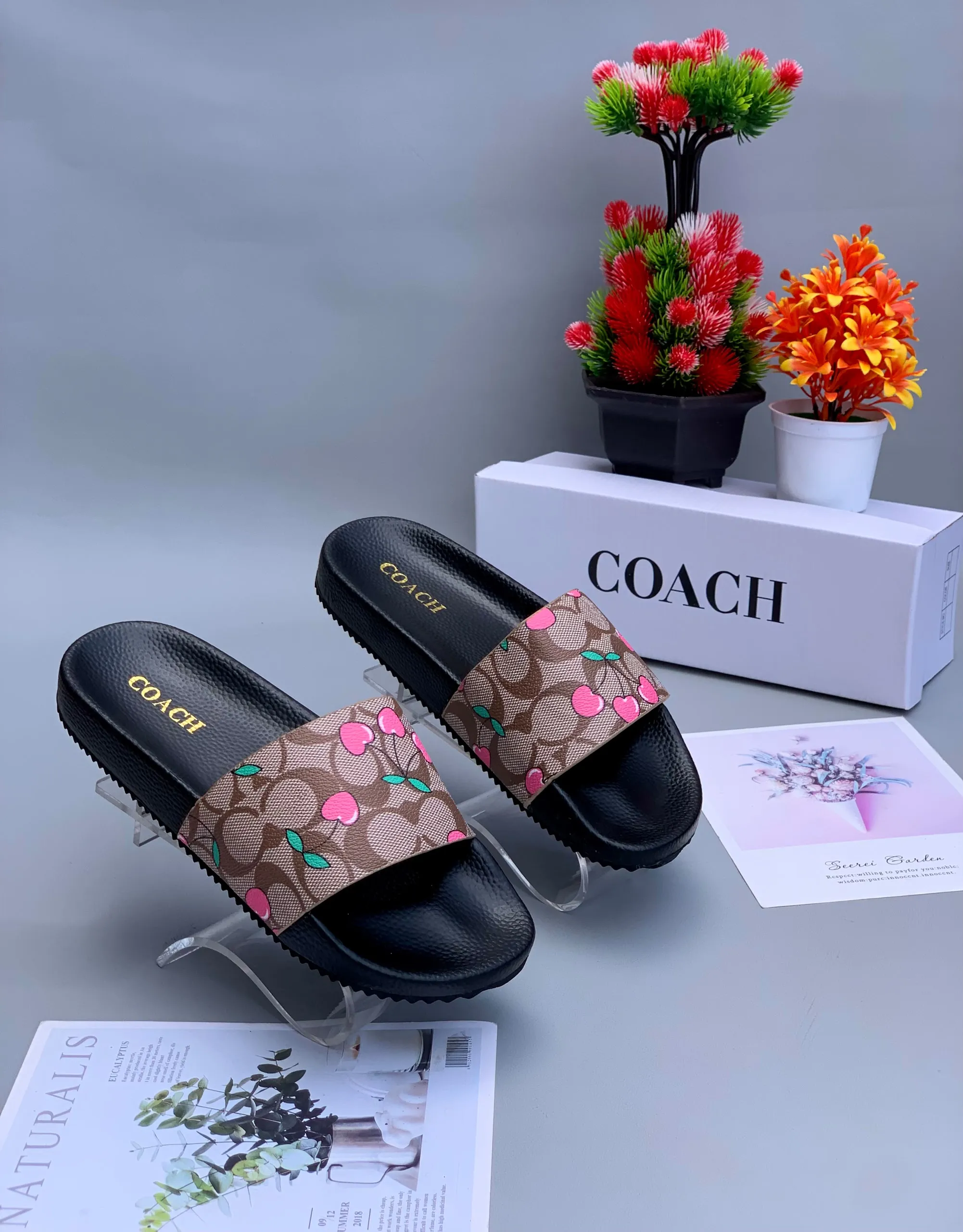 Coach Udele Signature Embossed Slides in Brown design