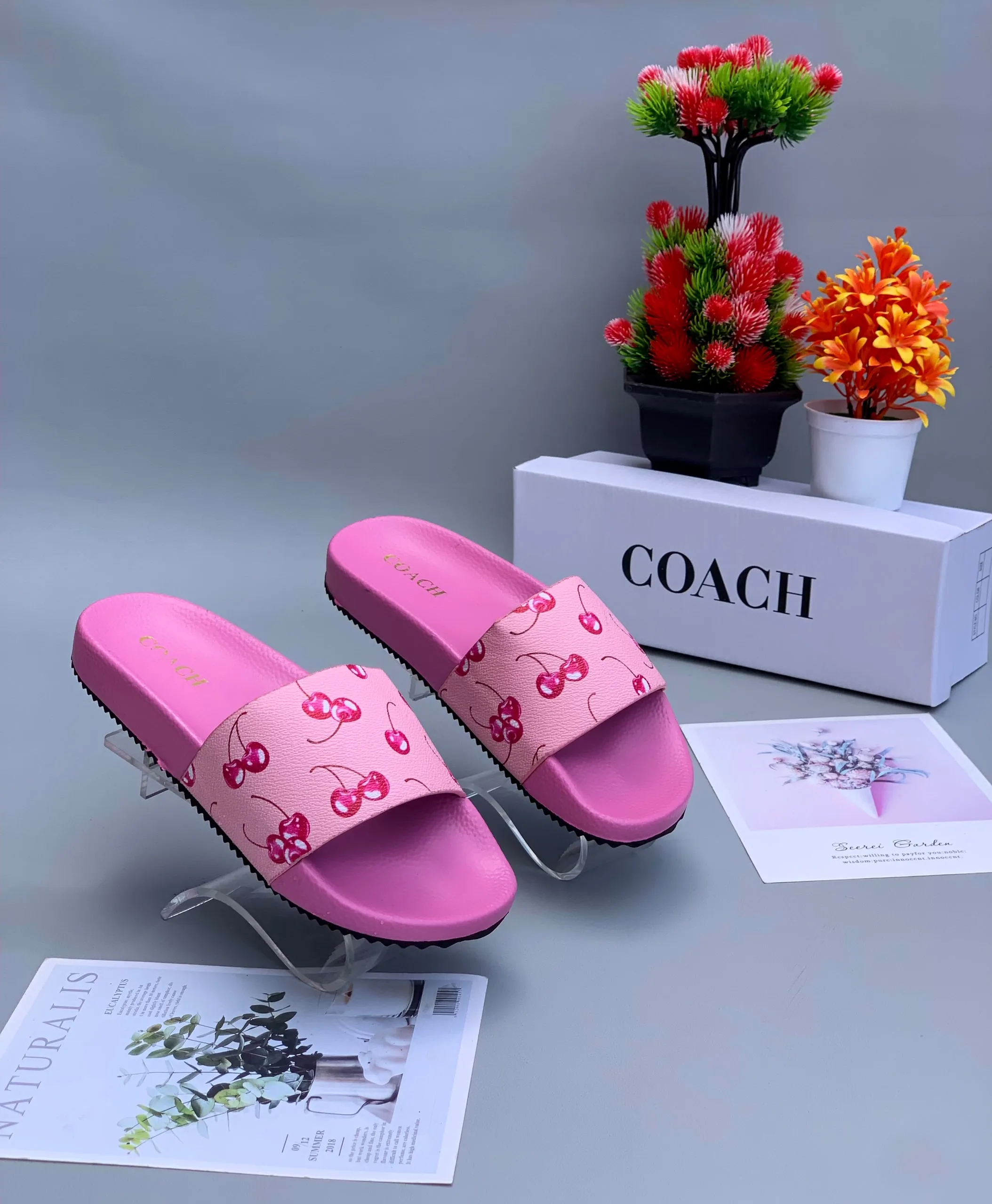 Coach Udele Signature Embossed Slides in Pink